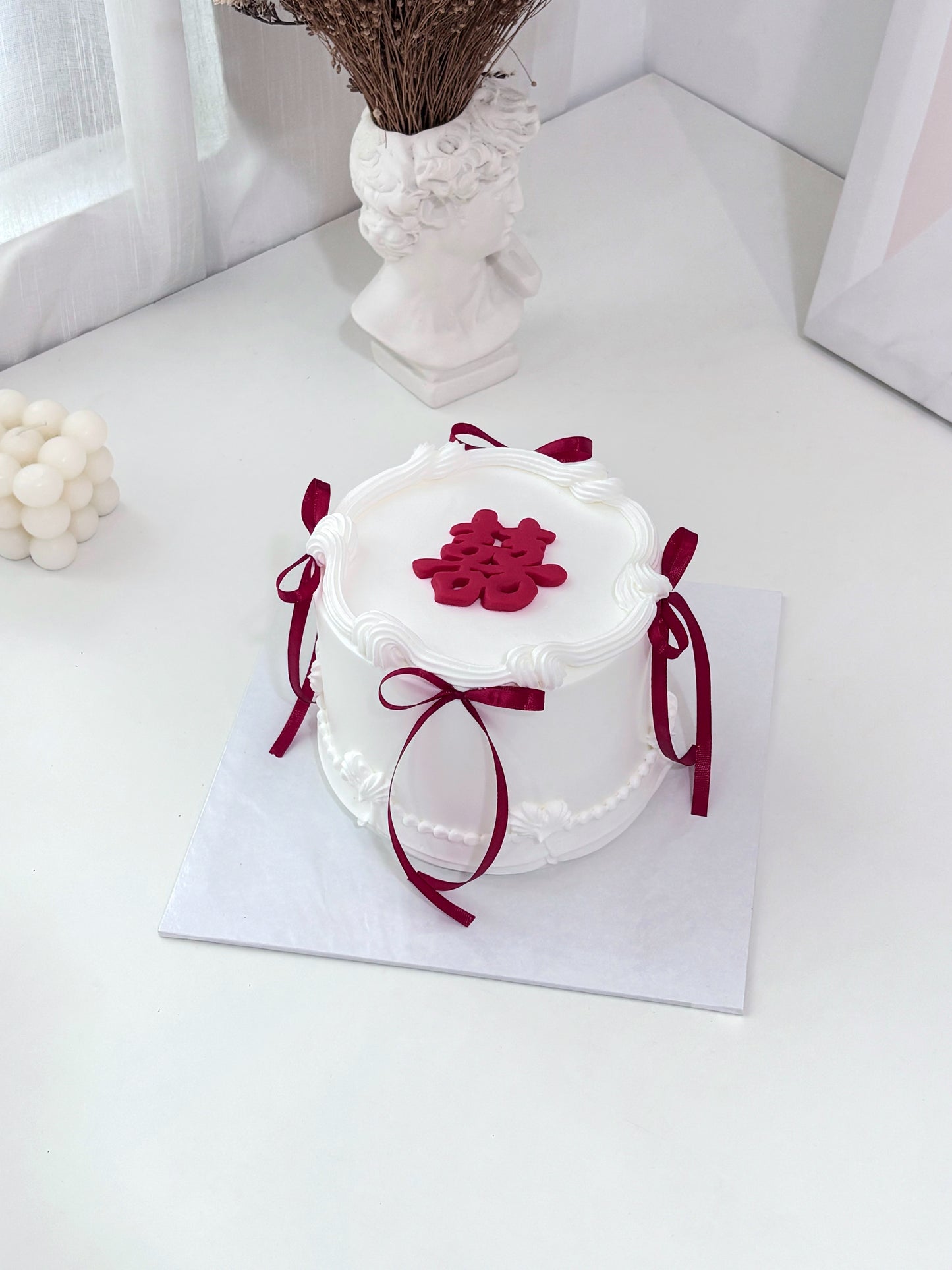 Vintage Wedding Cake with Red Ribbon